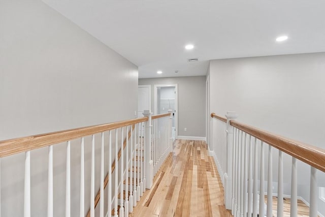168 Justice Hill Rd Oakmont, Unit Oakmont, Sterling, MA 01564 - hallway with recessed lighting, light wood finished floors, baseboards, and an upstairs landing
