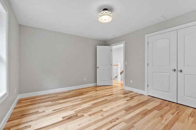 168 Justice Hill Rd Oakmont, Unit Oakmont, Sterling, MA 01564 - unfurnished bedroom with light wood-style floors, baseboards, and a closet