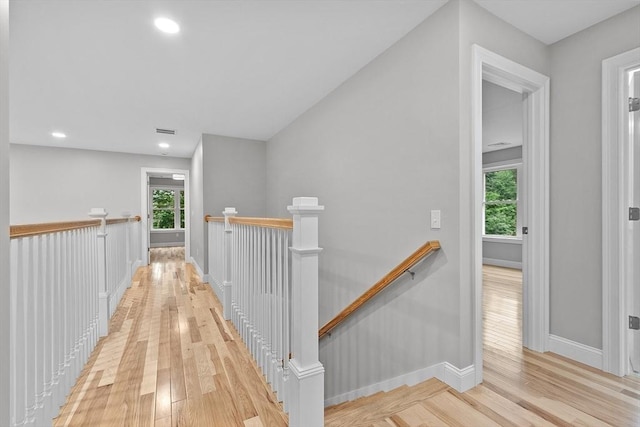 168 Justice Hill Rd Oakmont, Unit Oakmont, Sterling, MA 01564 - hall with an upstairs landing, baseboards, healthy amount of natural light, light wood-style floors, and recessed lighting