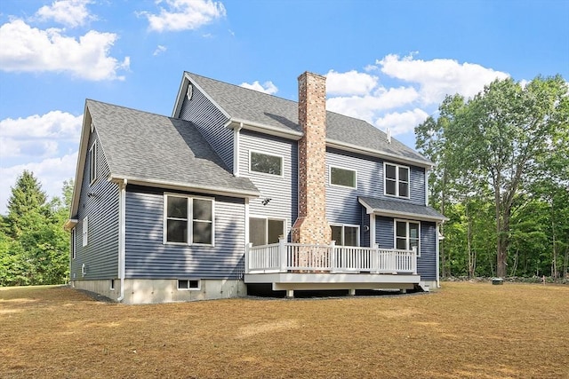 168 Justice Hill Rd Oakmont, Unit Oakmont, Sterling, MA 01564 - back of house featuring a chimney, a wooden deck, a yard, and a shingled roof