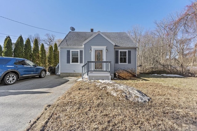 bungalow with a shingled roof