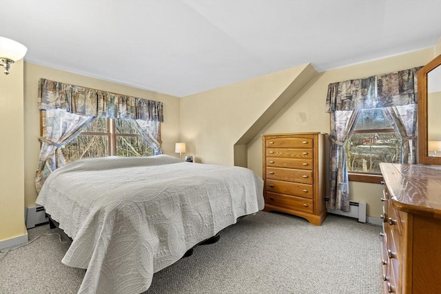 carpeted bedroom featuring baseboards, multiple windows, and baseboard heating