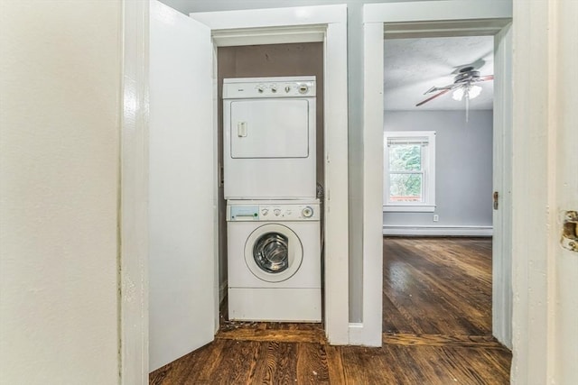 328 E Main St, Marlborough, MA 01752 - laundry area featuring stacked washer / drying machine, a baseboard heating unit, wood finished floors, and a ceiling fan