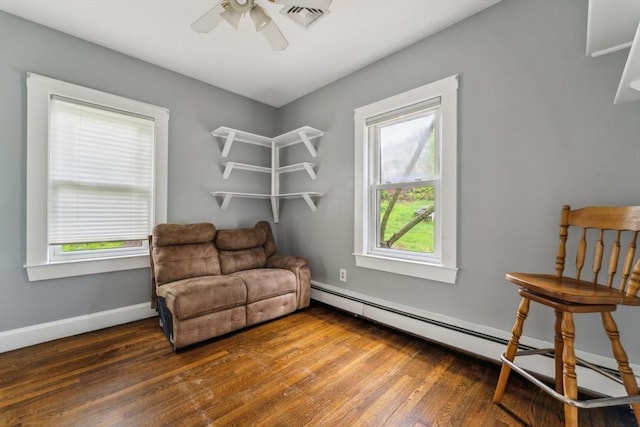 328 E Main St, Marlborough, MA 01752 - living area with ceiling fan, baseboard heating, wood finished floors, and baseboards