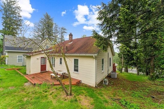 328 E Main St, Marlborough, MA 01752 - rear view of property featuring a chimney, a wooden deck, and a lawn