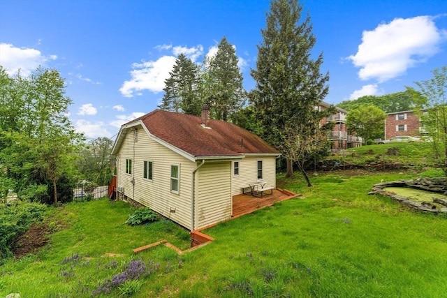 328 E Main St, Marlborough, MA 01752 - view of side of home with a chimney, a lawn, and a wooden deck