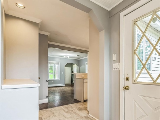 328 E Main St, Marlborough, MA 01752 - entryway with crown molding, arched walkways, baseboards, wood finished floors, and recessed lighting