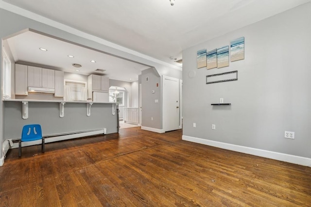 328 E Main St, Marlborough, MA 01752 - unfurnished living room with wood finished floors, baseboards, recessed lighting, and a baseboard heating unit