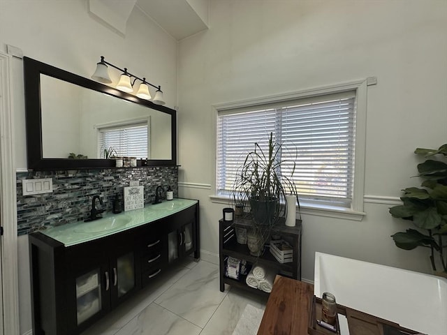 bathroom with vanity and decorative backsplash