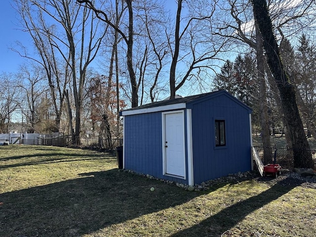 view of outbuilding featuring a yard