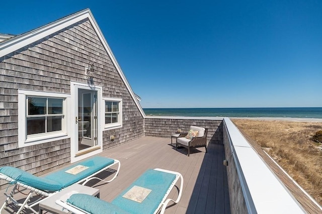 wooden deck featuring a water view