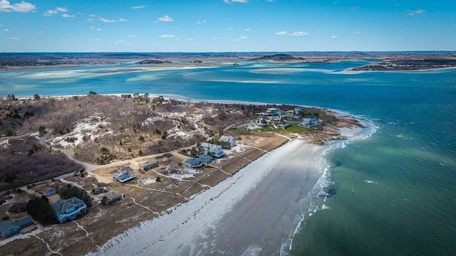 birds eye view of property with a view of the beach and a water view