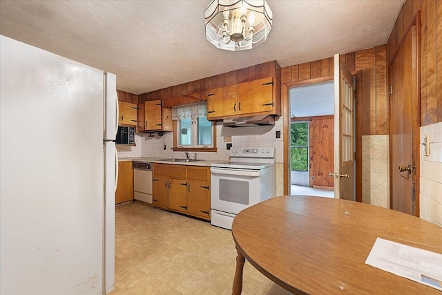 21 City Depot Rd, Charlton, MA 01507 - kitchen with white appliances, under cabinet range hood, light flooring, a sink, and light countertops