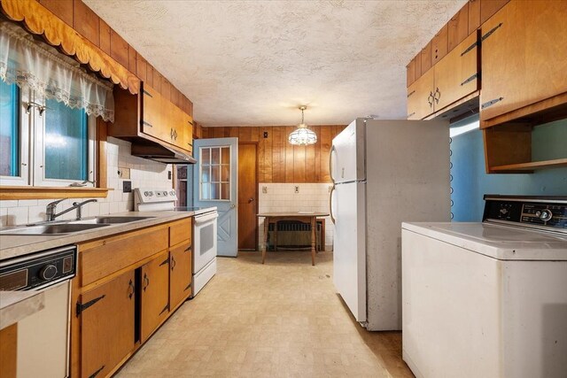 21 City Depot Rd, Charlton, MA 01507 - kitchen featuring washer / dryer, white appliances, a sink, light flooring, and light countertops