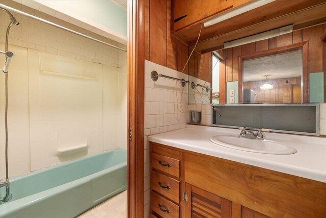 21 City Depot Rd, Charlton, MA 01507 - bathroom featuring vanity, bathing tub / shower combination, and tile walls