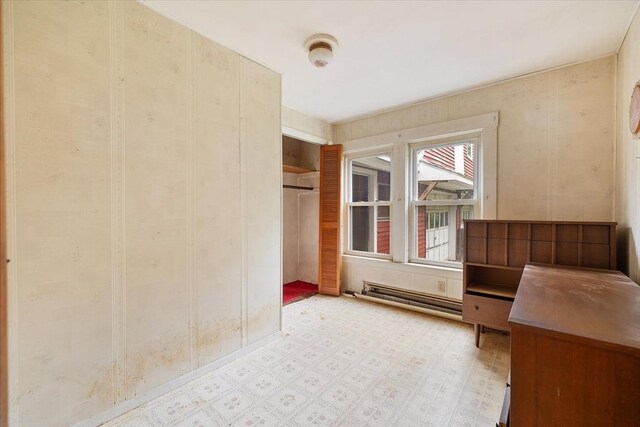 21 City Depot Rd, Charlton, MA 01507 - unfurnished bedroom featuring baseboard heating, light floors, and a closet