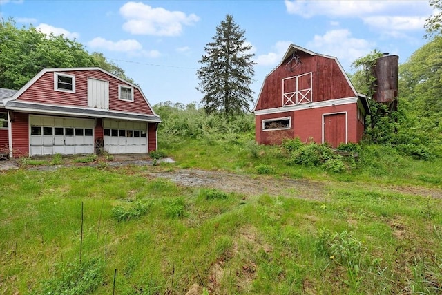 21 City Depot Rd, Charlton, MA 01507 - view of yard with a barn, a garage, and an outdoor structure
