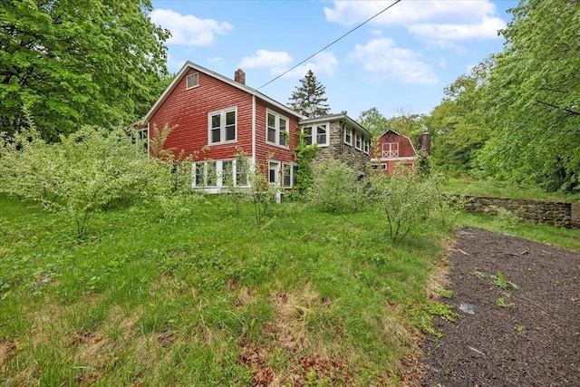 21 City Depot Rd, Charlton, MA 01507 - rear view of house with a chimney