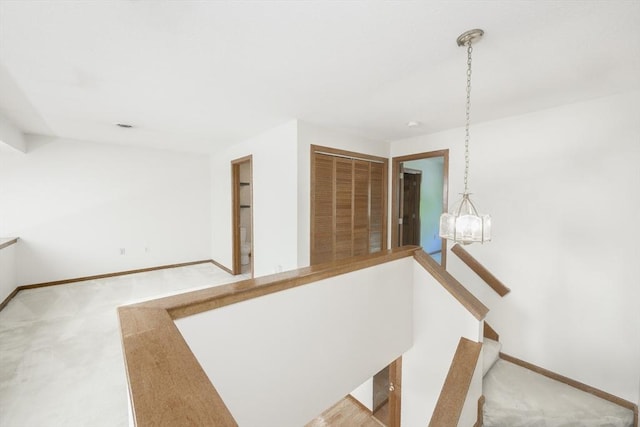 19 Spruce Pond Rd Unit 19, Franklin, MA 02038 - hallway featuring carpet floors, baseboards, and a chandelier