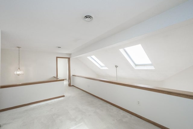 19 Spruce Pond Rd Unit 19, Franklin, MA 02038 - bonus room with a skylight, light carpet, lofted ceiling, and baseboards