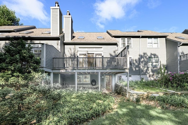 19 Spruce Pond Rd Unit 19, Franklin, MA 02038 - back of house featuring a chimney, a deck, and a shingled roof