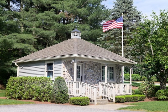 19 Spruce Pond Rd Unit 19, Franklin, MA 02038 - view of front of property with stone siding, roof with shingles, and covered porch