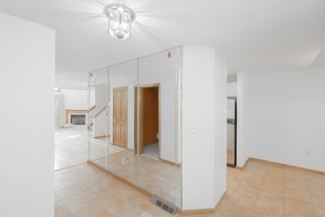 19 Spruce Pond Rd Unit 19, Franklin, MA 02038 - empty room featuring stairway, baseboards, and light tile patterned flooring