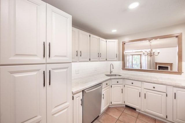 19 Spruce Pond Rd Unit 19, Franklin, MA 02038 - kitchen with stainless steel dishwasher, a sink, white cabinets, a chandelier, and recessed lighting