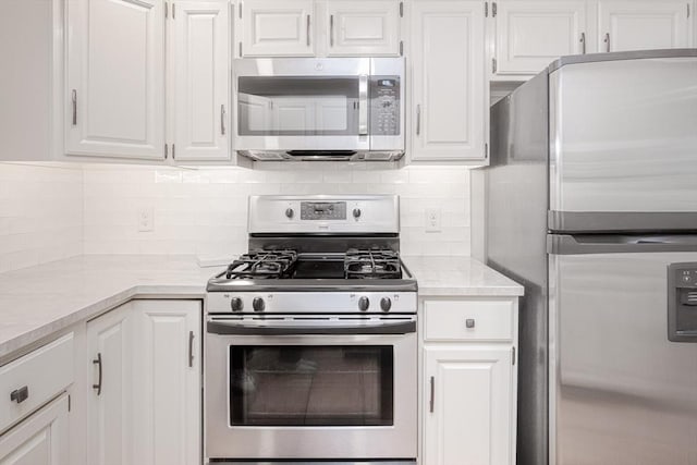 19 Spruce Pond Rd Unit 19, Franklin, MA 02038 - kitchen featuring appliances with stainless steel finishes, white cabinets, and tasteful backsplash