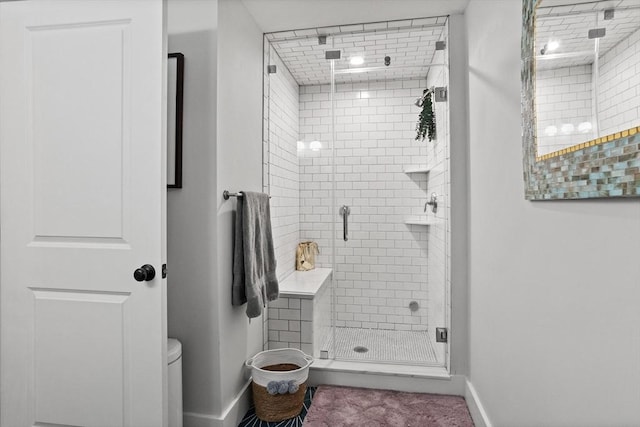 17 Kearney Sq Unit 209, Lowell, MA 01852 - bathroom featuring a stall shower, baseboards, and toilet
