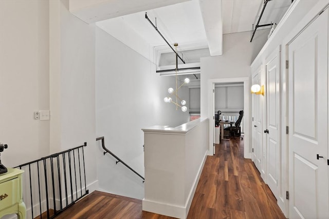 17 Kearney Sq Unit 209, Lowell, MA 01852 - corridor featuring an upstairs landing, wood finished floors, beamed ceiling, and baseboards
