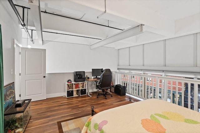 17 Kearney Sq Unit 209, Lowell, MA 01852 - bedroom with wood finished floors, a desk, and baseboards