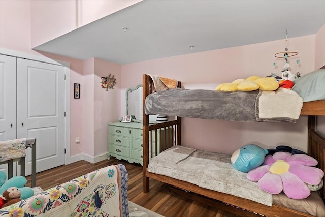 17 Kearney Sq Unit 209, Lowell, MA 01852 - bedroom featuring wood finished floors, baseboards, and a closet