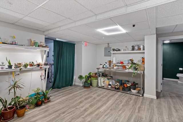 17 Kearney Sq Unit 209, Lowell, MA 01852 - bar featuring wood finished floors, a paneled ceiling, baseboards, and electric panel
