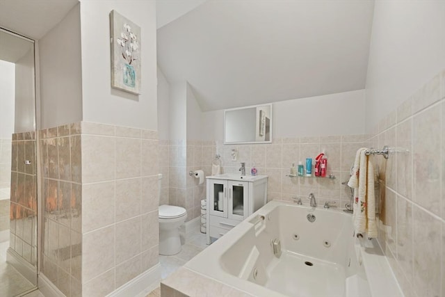 540 Rivet St, New Bedford, MA 02740 - bathroom with tile walls, a tub with jets, toilet, vanity, and lofted ceiling
