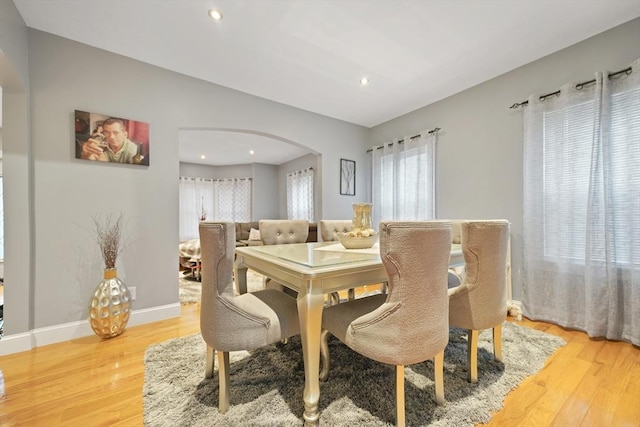 540 Rivet St, New Bedford, MA 02740 - dining room featuring arched walkways, light wood-type flooring, recessed lighting, and baseboards
