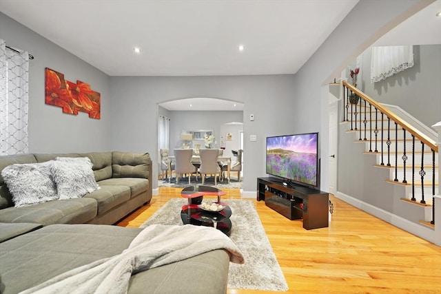 540 Rivet St, New Bedford, MA 02740 - living area featuring arched walkways, wood finished floors, stairway, and recessed lighting