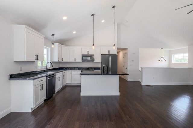 40 Jackson Ln, Barre, MA 01005 - kitchen with stainless steel microwave, refrigerator with ice dispenser, dishwashing machine, range, and dark countertops