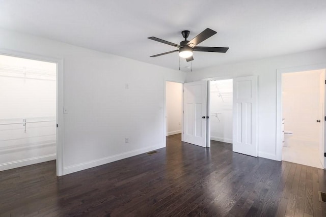 40 Jackson Ln, Barre, MA 01005 - unfurnished bedroom featuring a spacious closet, a closet, dark wood finished floors, and baseboards