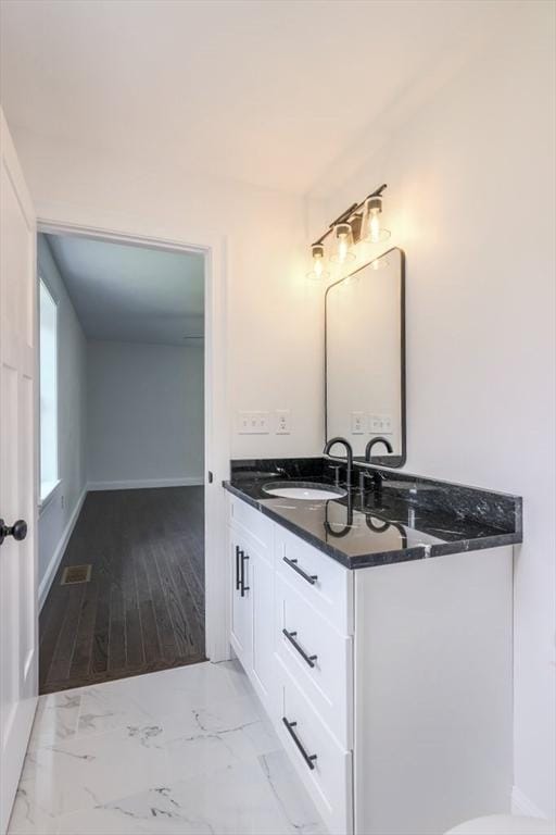 40 Jackson Ln, Barre, MA 01005 - bathroom featuring vanity, marble look tile flooring, and baseboards