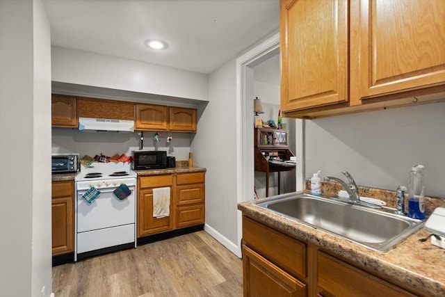 kitchen featuring white range with electric stovetop, sink, extractor fan, and light hardwood / wood-style flooring