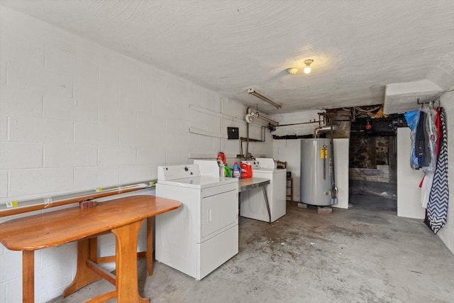 clothes washing area with gas water heater and washer and clothes dryer