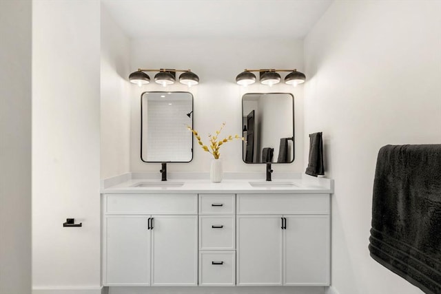 bathroom with double vanity and a sink