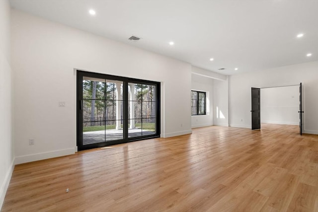 interior space featuring visible vents, recessed lighting, light wood-type flooring, and baseboards