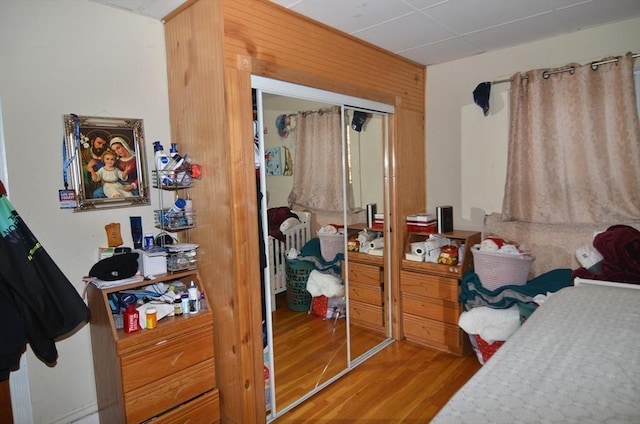 bedroom with a closet and hardwood / wood-style flooring