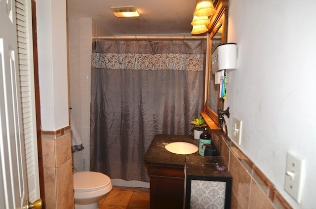 bathroom with vanity, toilet, tile patterned floors, and a shower with curtain