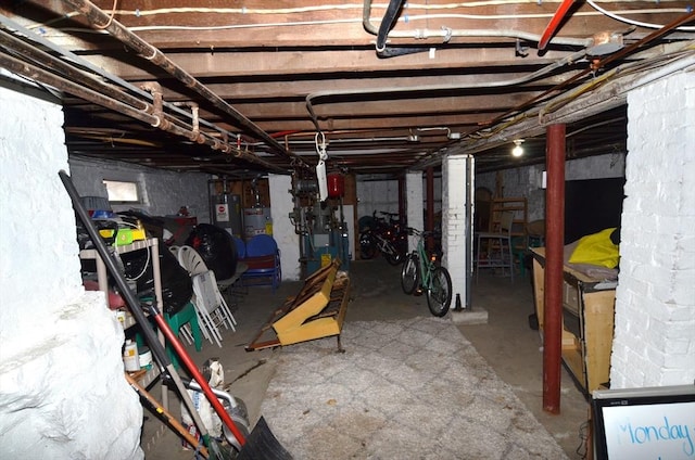 basement with electric water heater and water heater