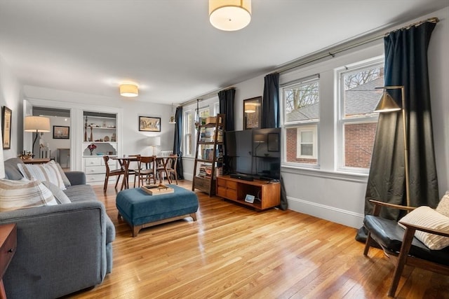 65-67 Westchester Rd, Newton, MA 02458 - living room with baseboards and light wood-style floors
