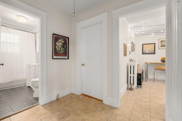 65-67 Westchester Rd, Newton, MA 02458 - corridor with light tile patterned flooring and baseboards