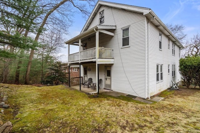 65-67 Westchester Rd, Newton, MA 02458 - rear view of property featuring a patio, a balcony, and a lawn